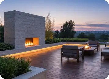 Modern outdoor fireplace and seating at dusk